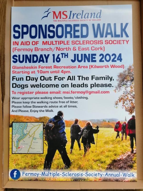  A group of people walking across vibrant green grass, surrounded by trees. Text overlay promotes the Fermoy Annual Walk