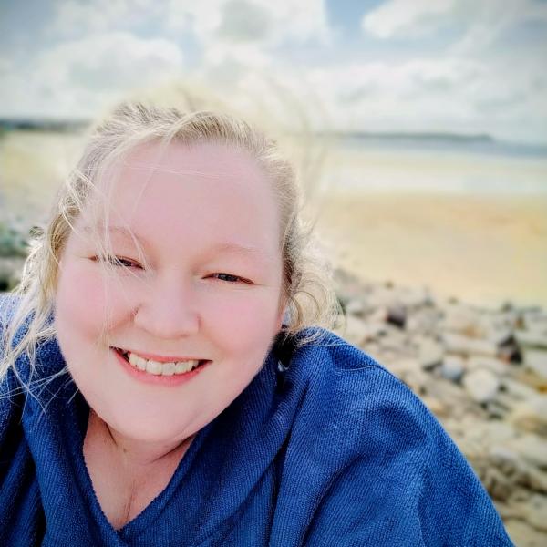 Portrait of Stephanie O’Brien outdoors by the beach for the MS Journeys campaign.