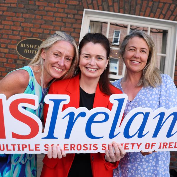 MS Ireland representatives at Leinster House holding an MS Ireland sign during the Budget 2027 campaign launch.