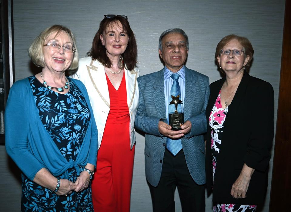 Four attendees at the MS Ireland Annual Awards 2025, with the Volunteer of the Year winner holding their trophy
