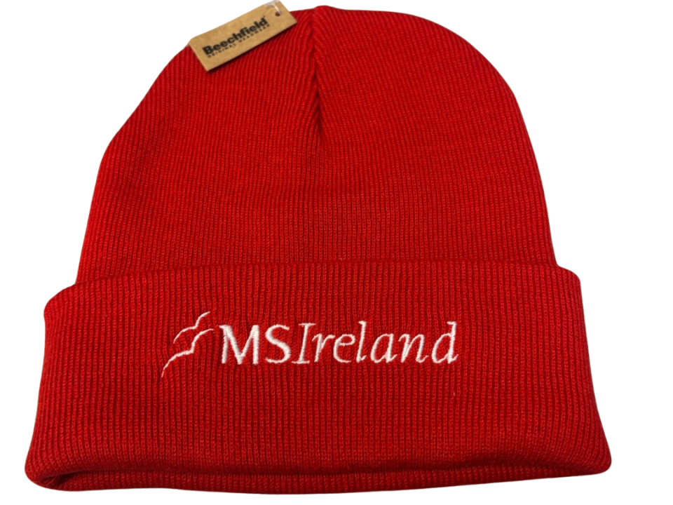 Red MS Ireland knitted beanie hat with white embroidered MS Ireland logo on the front