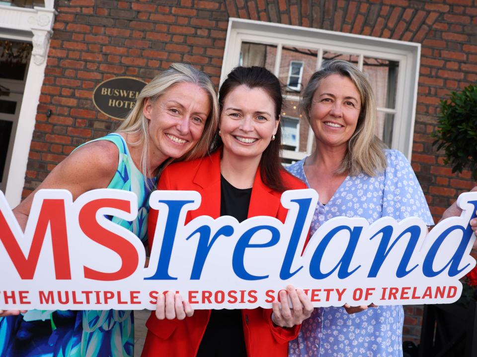 MS Ireland representatives at Leinster House holding an MS Ireland sign during the Budget 2027 campaign launch.