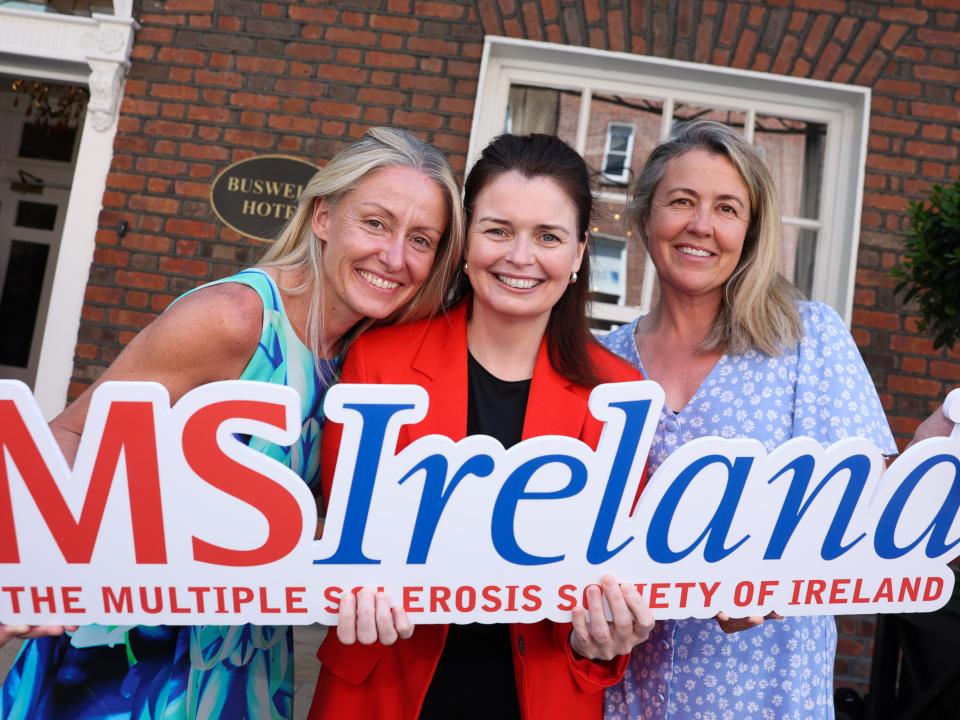MS Ireland representatives at Leinster House holding an MS Ireland sign during the Budget 2027 campaign launch.