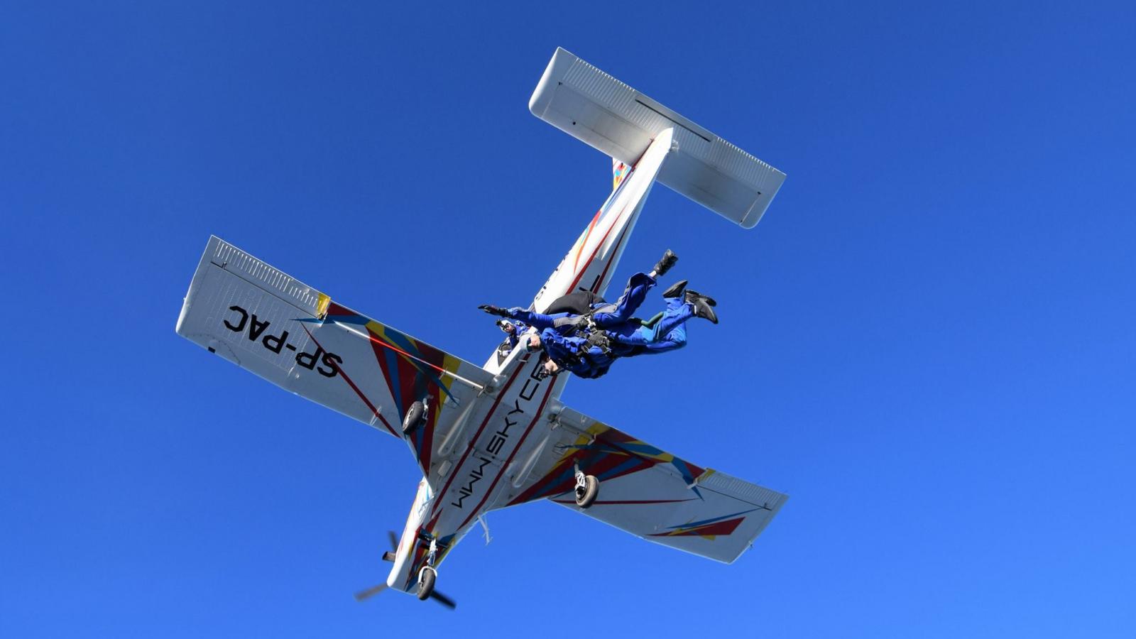 Blue skies with a small plane flying