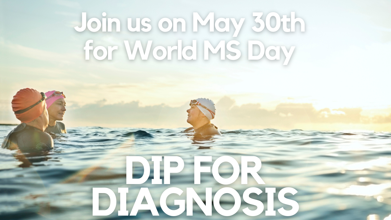 Three people in the sea, taking part in the 'Dip for Diagnosis' campaign for World MS Day